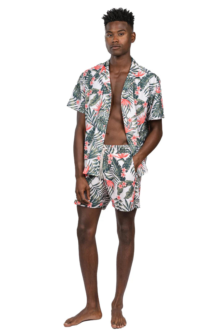 Full-size picture of James wearing Leaf Print Volley Shorts in Green Pink with the shirt unbuttoned, demonstrating the effortless style and true-to-size fit of the shorts, ideal for seamless transitions from water to dry land during summer activities