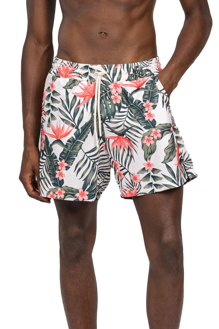 Close-up view of James wearing Leaf Print Volley Shorts in Green Pink, showcasing the vibrant leaf print and comfortable fit, perfect for summer pool and resort plans